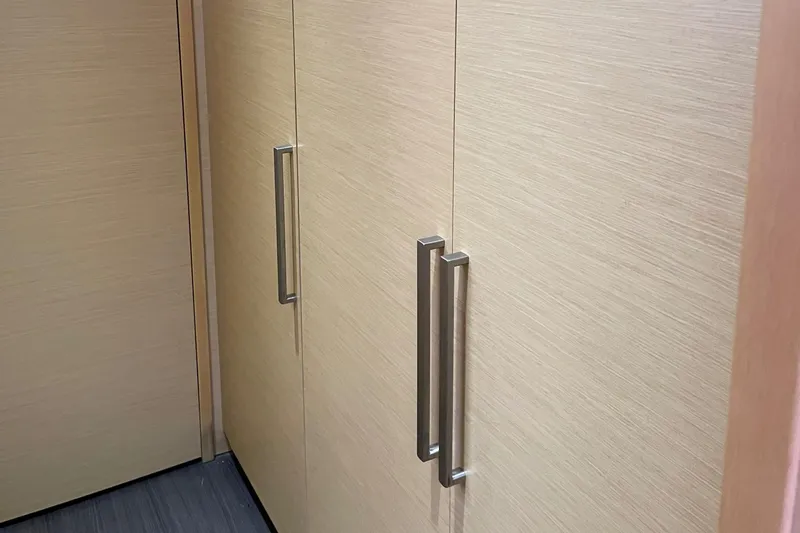 Slide: The Image of Interior of 2014 Lagoon 620 with modern cabinet handles. - 9