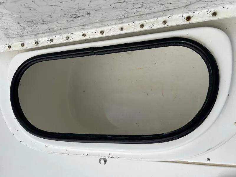 Slide: The Image of Oval hatch detail on 2000 Triton 23 Tunnel boat. - 6
