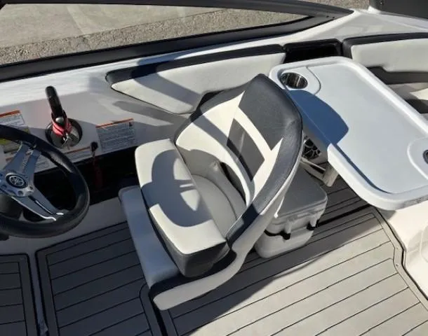 Slide: The Image of 2020 Yamaha Boats 195S interior with steering wheel and seating area. - 16