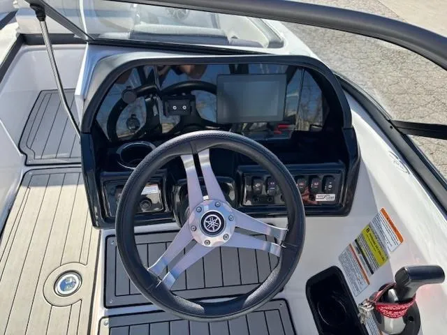Slide: The Image of 2020 Yamaha Boats 195S dashboard with steering wheel and controls. - 18