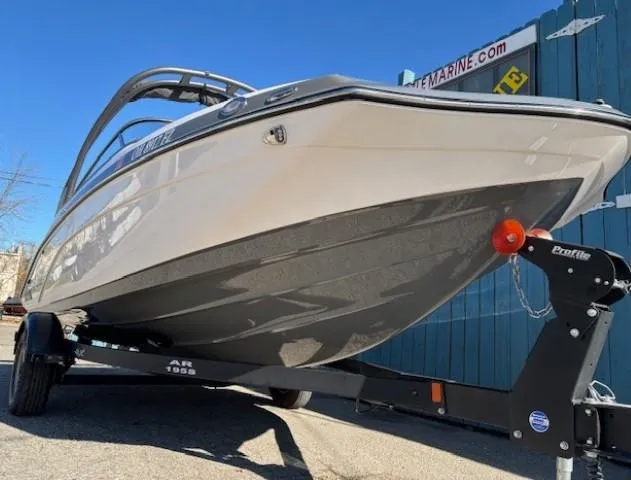 Slide: The Image of 2020 Yamaha Boats 195S on trailer, sleek design, parked outdoors. - 2