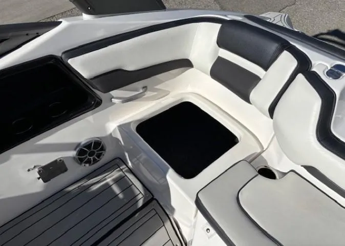 Slide: The Image of Interior seating of 2020 Yamaha Boats 195S with black and white upholstery. - 26
