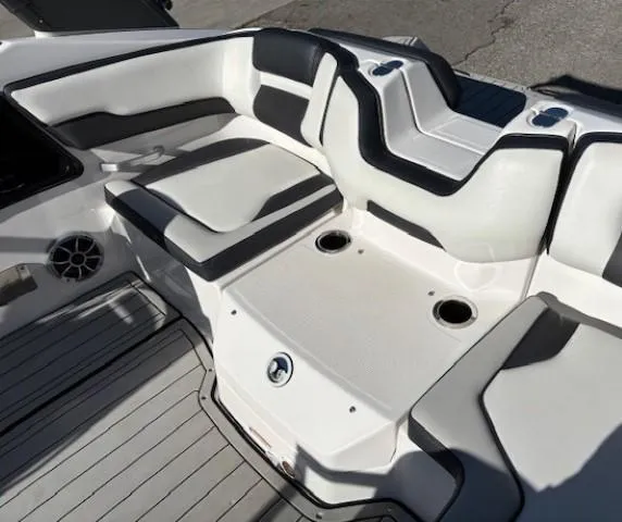 Slide: The Image of 2020 Yamaha Boats 195S interior seating with cup holders and sleek design. - 28