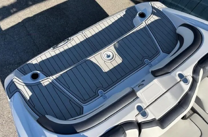 Slide: The Image of 2020 Yamaha Boats 195S swim platform with cushioned seating and sleek design. - 30