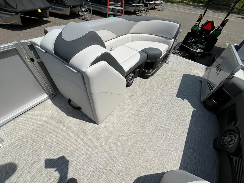Slide: The Image of 2025 Avalon LSZ Versatile Rear Bench with sleek gray upholstery on a boat deck. - 11