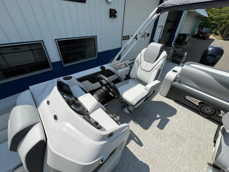 Slide: The Image of 2025 Avalon LSZ Versatile Rear Bench boat interior with modern helm and seating. - 14