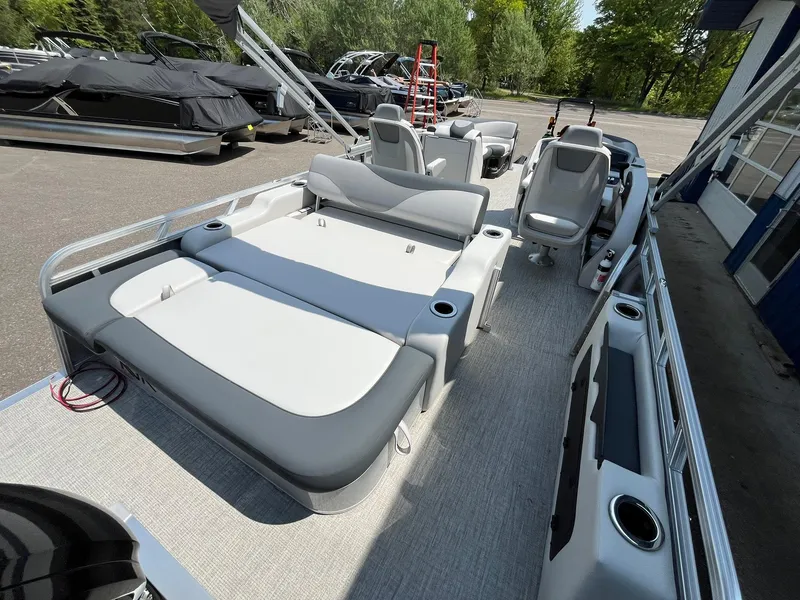 Slide: The Image of 2025 Avalon LSZ Versatile Rear Bench pontoon boat with spacious seating and modern design. - 19
