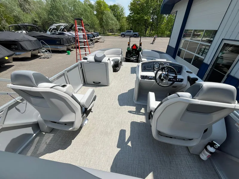 Slide: The Image of 2025 Avalon LSZ Versatile Rear Bench boat interior with modern seating and steering console. - 21