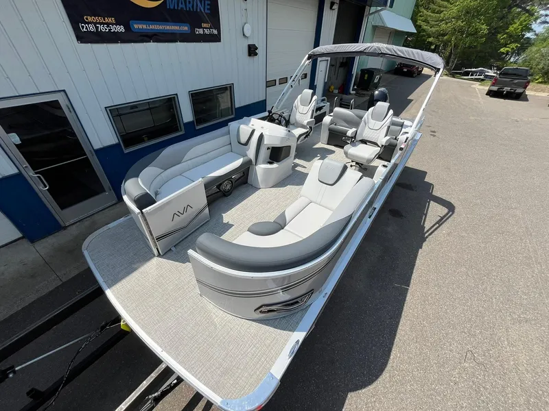 Slide: The Image of 2025 Avalon LSZ Versatile Rear Bench pontoon boat with luxurious seating and modern design. - 7