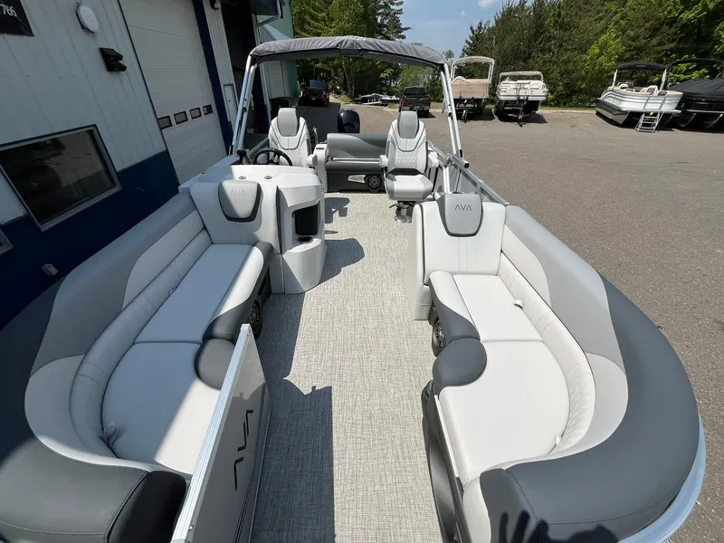 Slide: The Image of 2025 Avalon LSZ Versatile Rear Bench pontoon boat with spacious seating and modern design. - 9