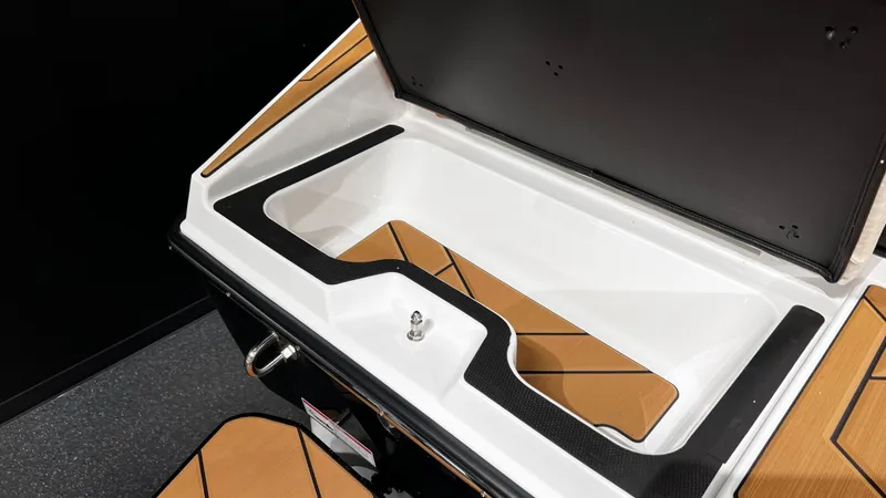 Slide: The Image of 2024 Supreme S220 boat storage compartment with sleek design and modern features. - 14