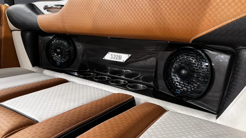 Slide: The Image of 2024 Supreme S220 interior with premium speakers and luxurious brown leather seats. - 19