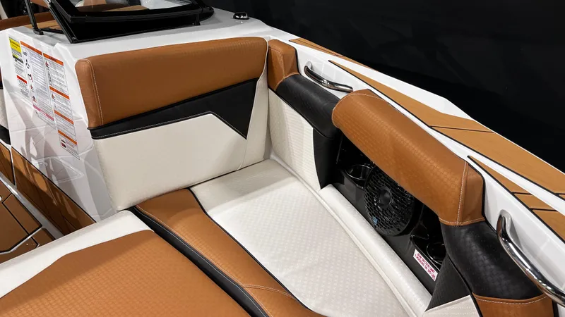 Slide: The Image of 2024 Supreme S220 boat interior with brown and white leather seating. - 31