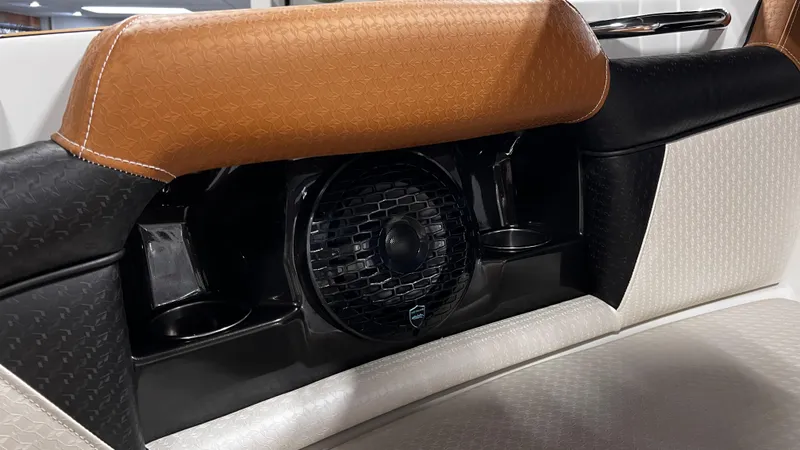 Slide: The Image of 2024 Supreme S220 boat interior with speaker and cup holders. - 34