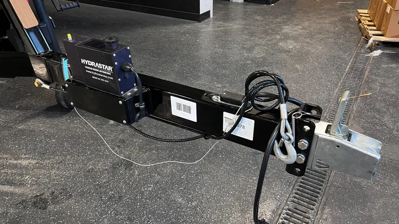 Slide: The Image of 2024 Supreme S220 trailer hitch with Hydrostar brake actuator on a concrete floor. - 6