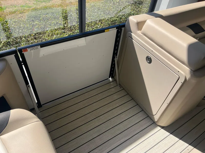 Slide: The Image of 2024 G3 322SS boat interior with beige seating and wood-patterned flooring. - 10