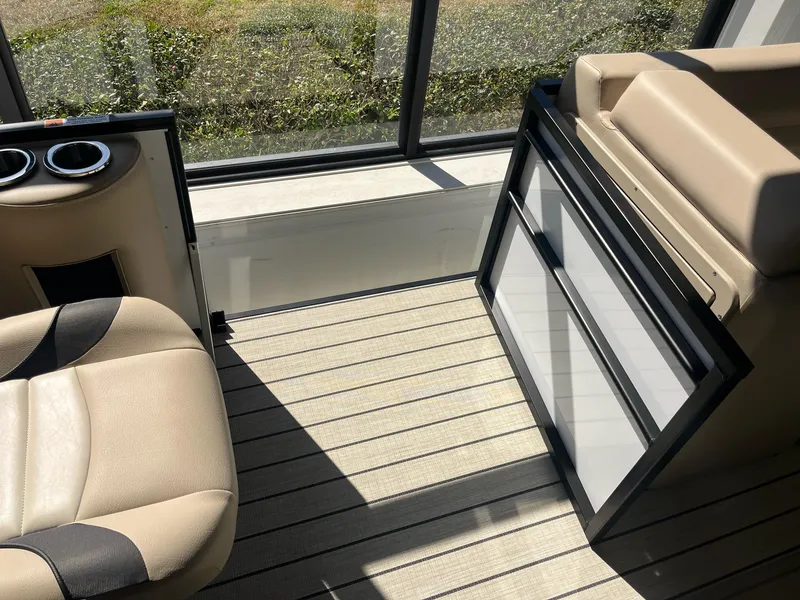 Slide: The Image of 2024 G3 322SS boat interior with beige seating and striped flooring. - 11