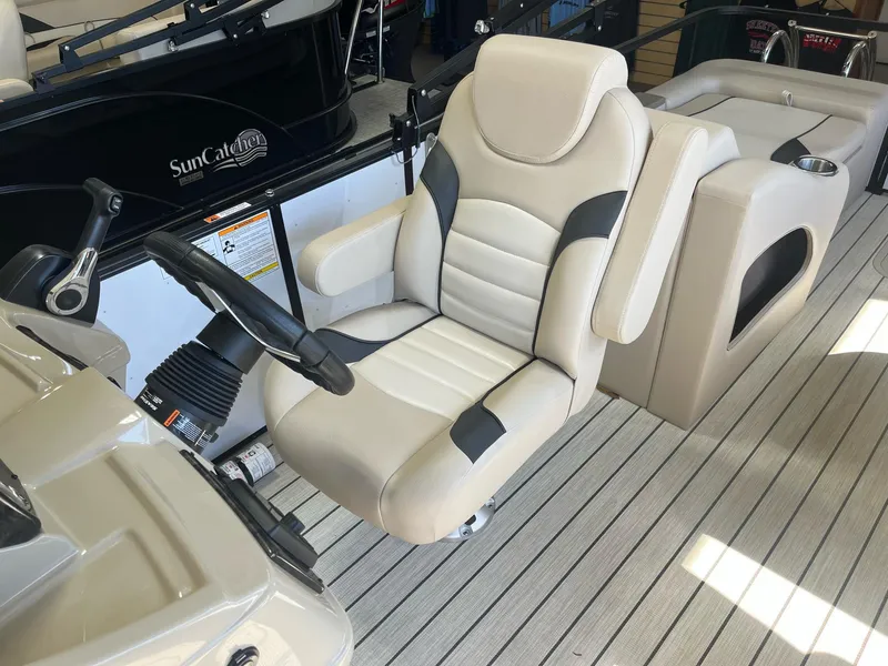 Slide: The Image of 2024 G3 322SS boat captain's chair with steering wheel on deck. - 13