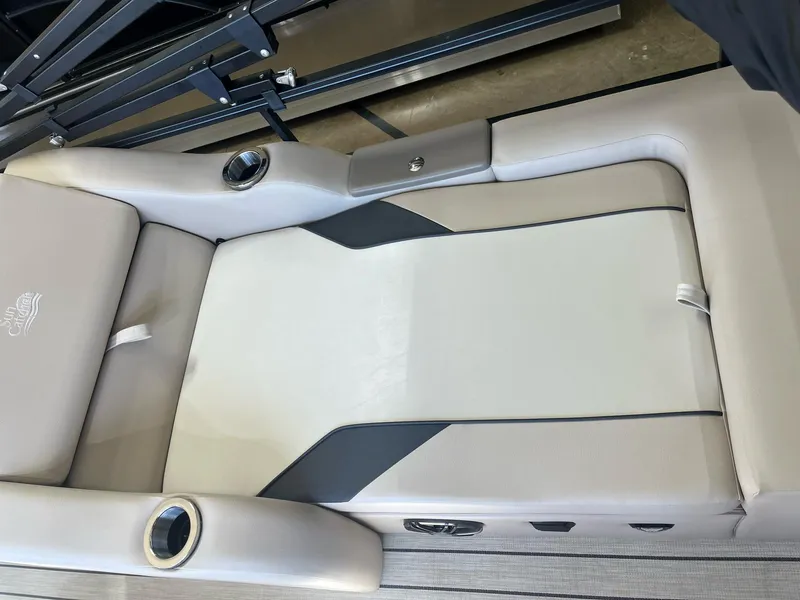 Slide: The Image of 2024 G3 322SS boat seat with beige upholstery and cup holders. - 16