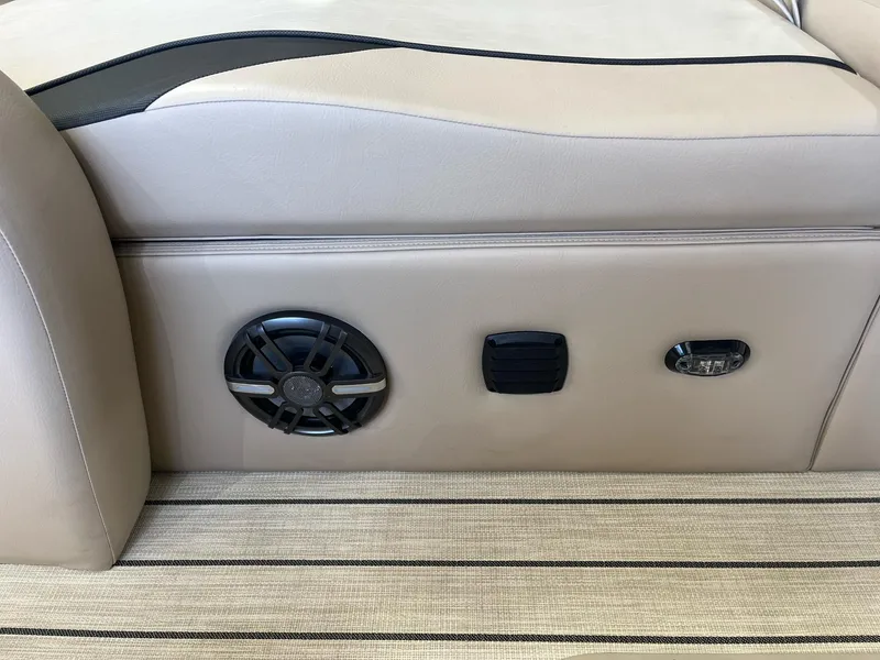 Slide: The Image of 2024 G3 322SS boat interior with speaker and controls on beige seating. - 21
