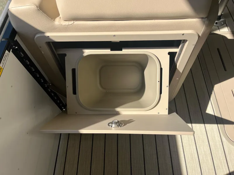 Slide: The Image of 2024 G3 322SS boat storage compartment with open door, beige interior, and striped flooring. - 22