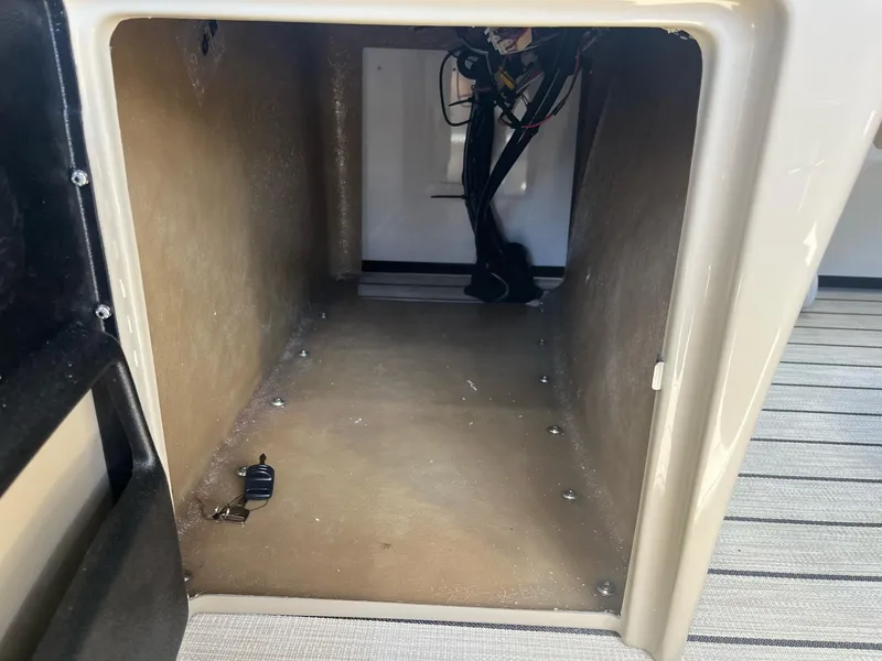 Slide: The Image of 2024 G3 322SS storage compartment interior with wiring visible. - 23