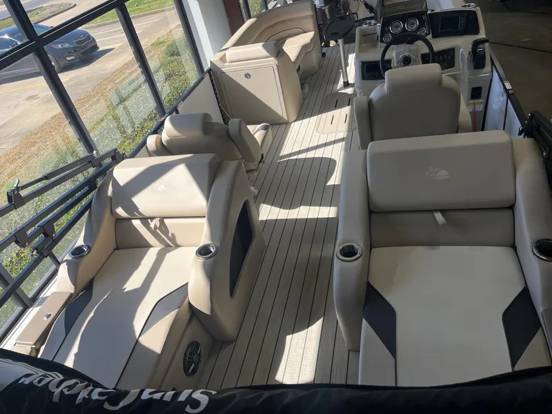 Slide: The Image of 2024 G3 322SS boat interior with beige seating and modern dashboard. - 4