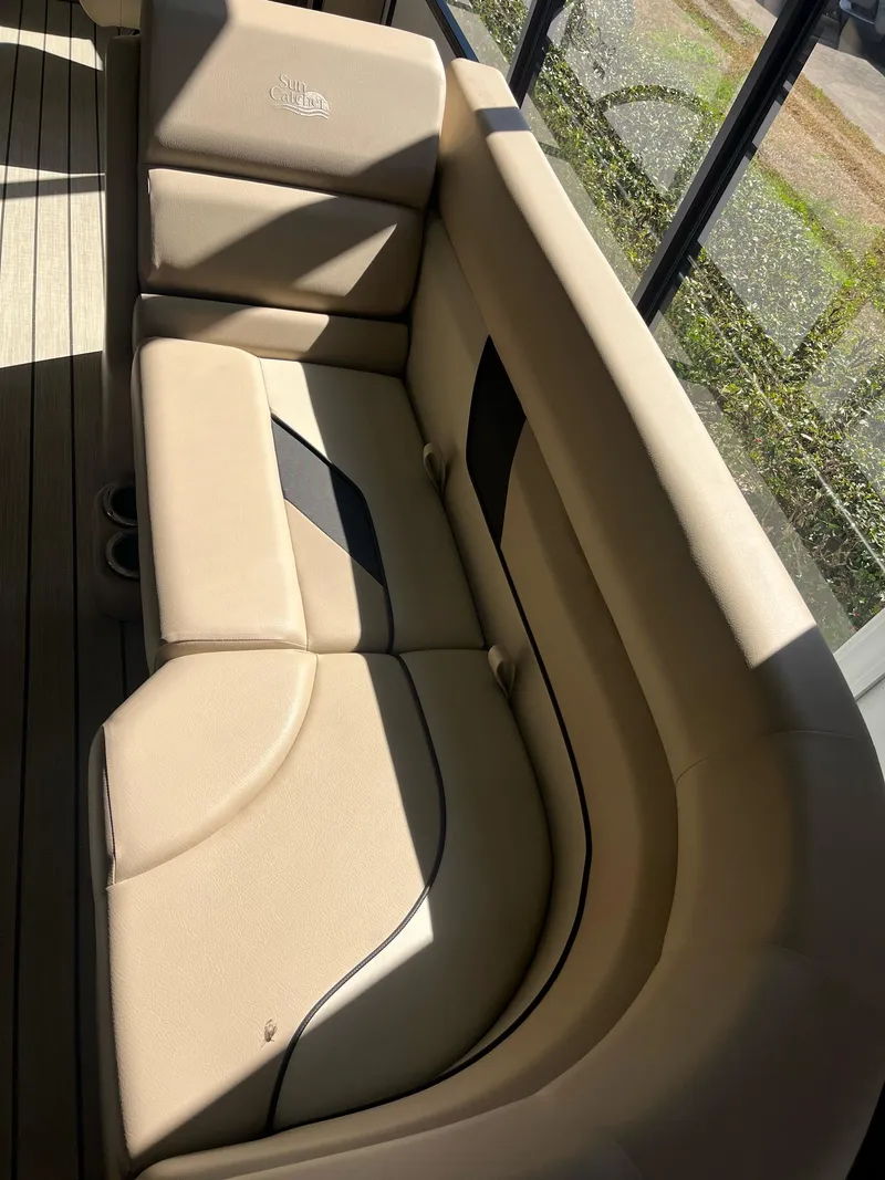 Slide: The Image of 2024 G3 322SS boat interior with beige cushioned seating. - 6