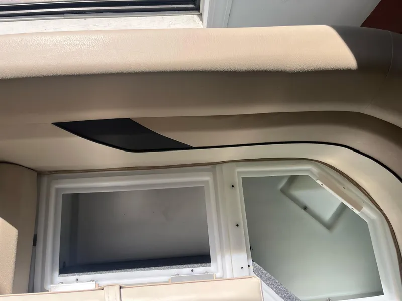 Slide: The Image of 2024 G3 322SS interior detail with beige upholstery and window. - 7