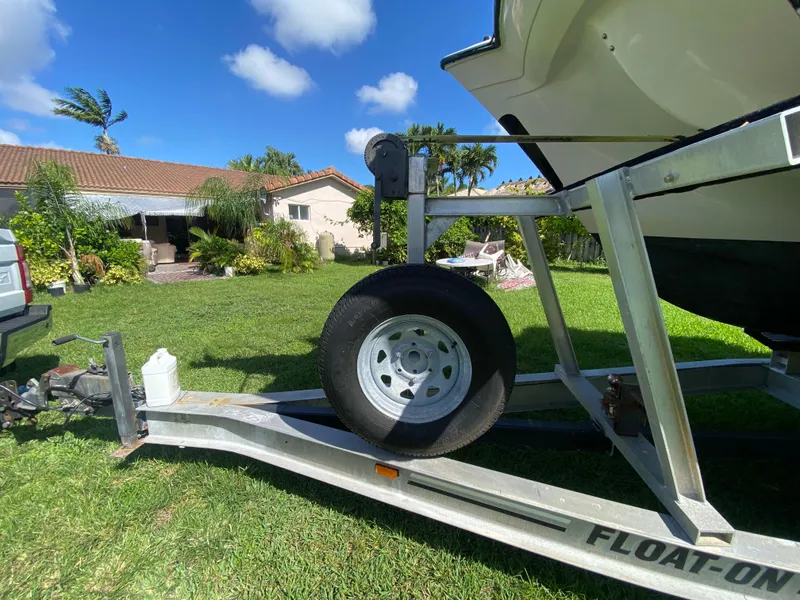 Slide: The Image of Grady-White X-26 Tiger Cat boat on trailer in sunny backyard, 1999 model. - 13