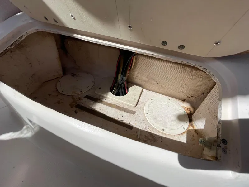 Slide: The Image of Open storage compartment in 1999 Grady-White X-26 Tiger Cat boat. - 26