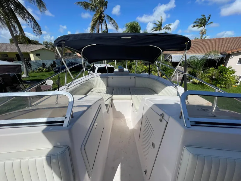 Slide: The Image of 1999 Grady-White X-26 Tiger Cat boat with canopy, parked outdoors. - 30