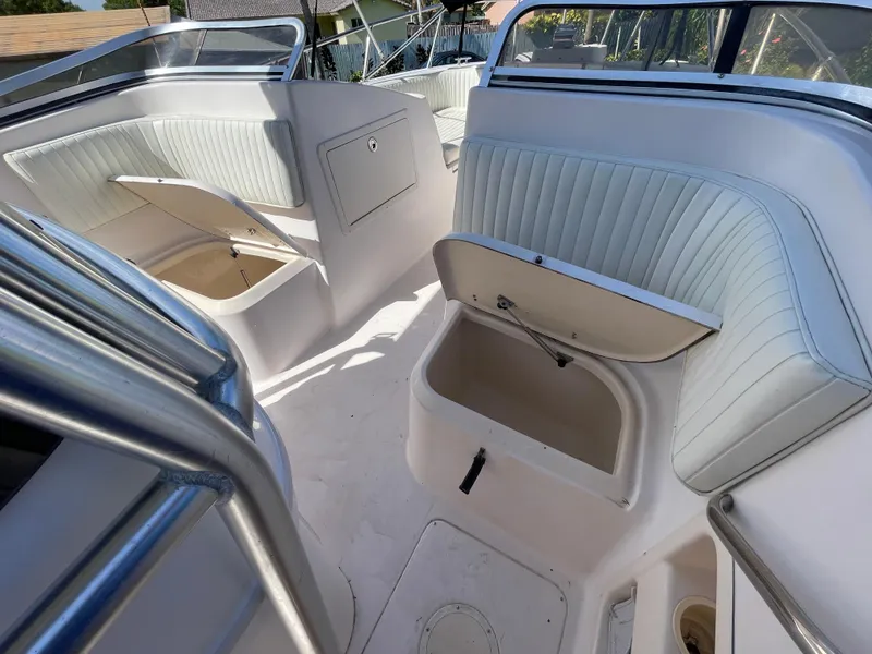 Slide: The Image of 1999 Grady-White X-26 Tiger Cat boat interior with open storage compartments. - 32