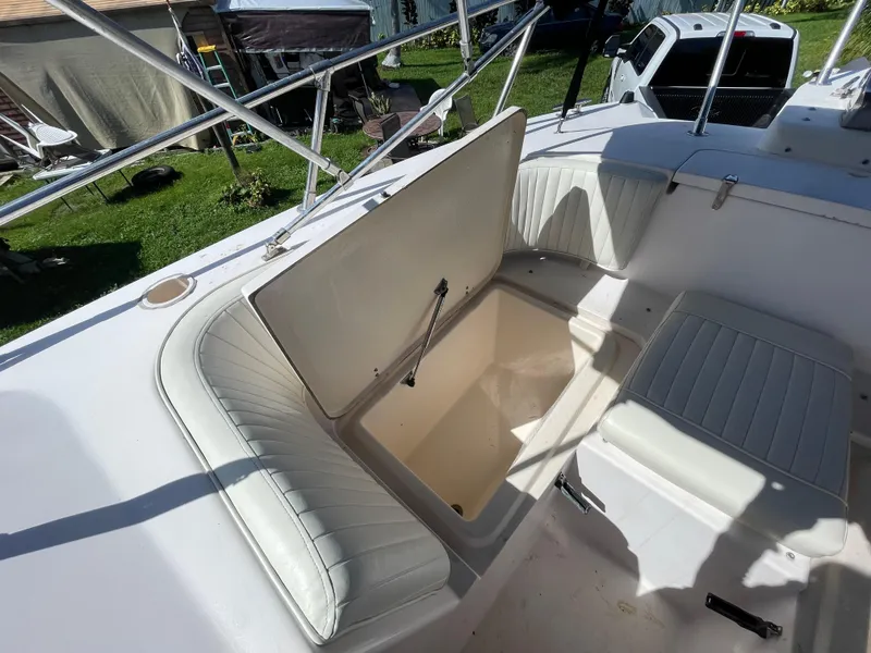 Slide: The Image of 1999 Grady-White X-26 Tiger Cat boat interior with open storage compartment. - 39