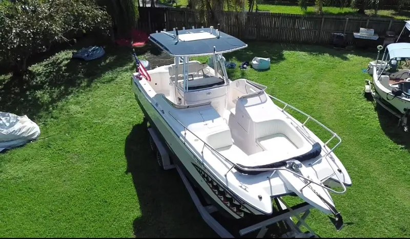 Slide: The Image of 1999 Grady-White X-26 Tiger Cat boat on grass, aerial view. - 4