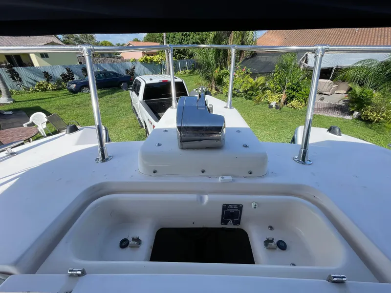 Slide: The Image of 1999 Grady-White X-26 Tiger Cat boat deck with railing and storage compartment. - 41