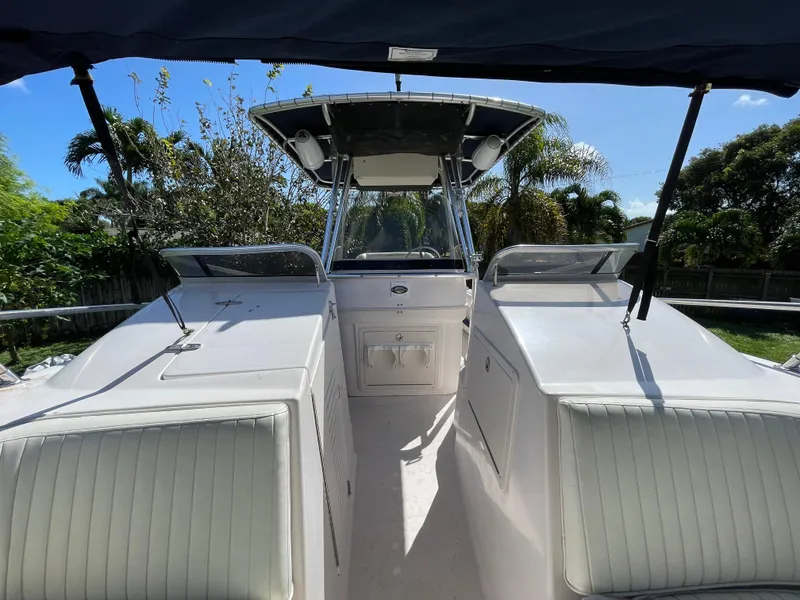 Slide: The Image of 1999 Grady-White X-26 Tiger Cat boat interior with seating and console. - 42