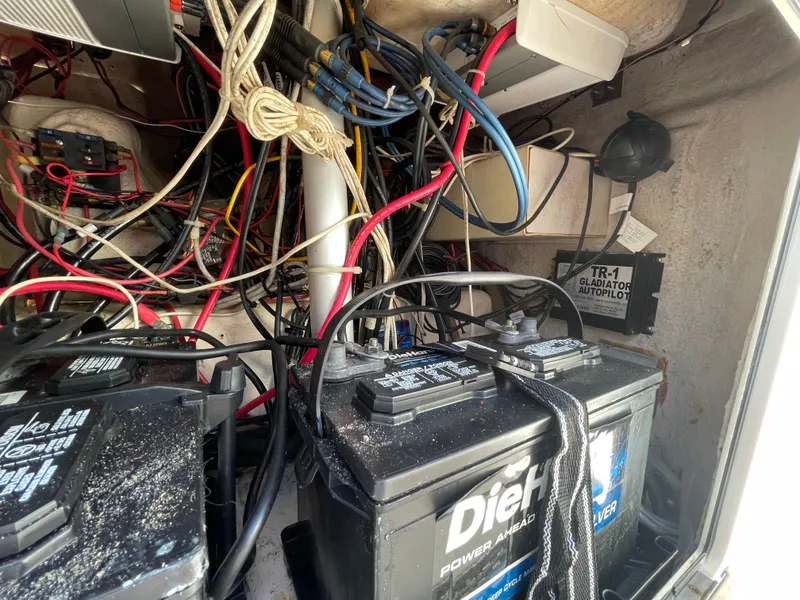 Slide: The Image of Battery compartment with wiring in a 1999 Grady-White X-26 Tiger Cat boat. - 44