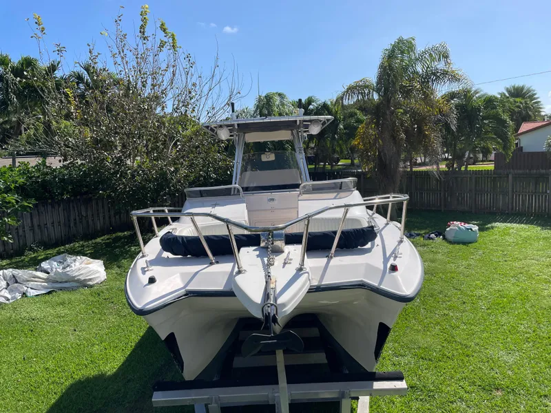 Slide: The Image of 1999 Grady-White X-26 Tiger Cat boat on trailer in sunny backyard. - 5