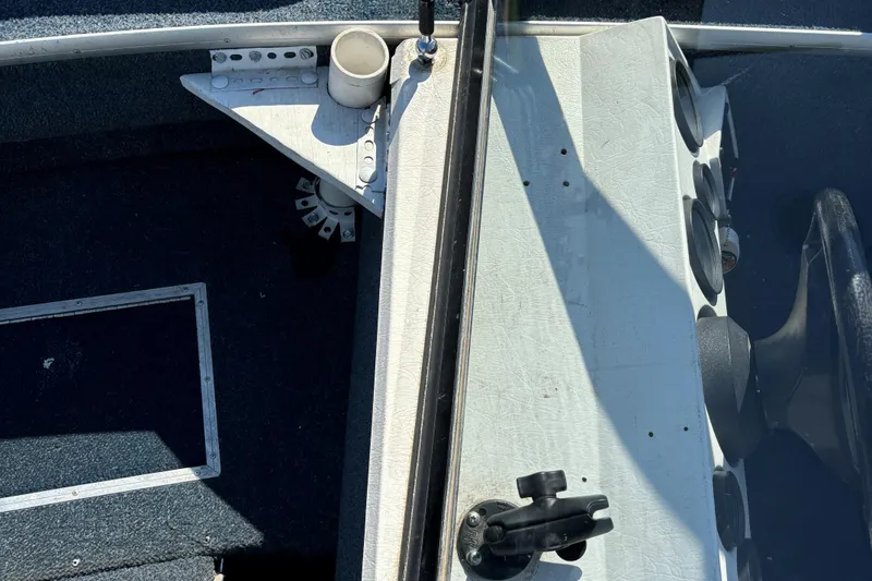 Slide: The Image of 1993 Lowe Fish-n-pro 1930 boat interior with steering console and cup holder. - 5