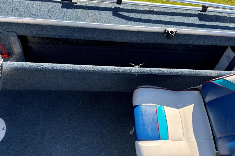 Slide: The Image of 1993 Lowe Fish-n-pro 1930 boat interior with blue and gray seating. - 7