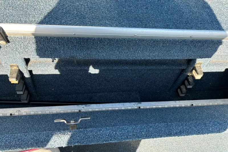 Slide: The Image of Open storage compartment in a 1993 Lowe Fish-n-pro 1930 boat. - 8