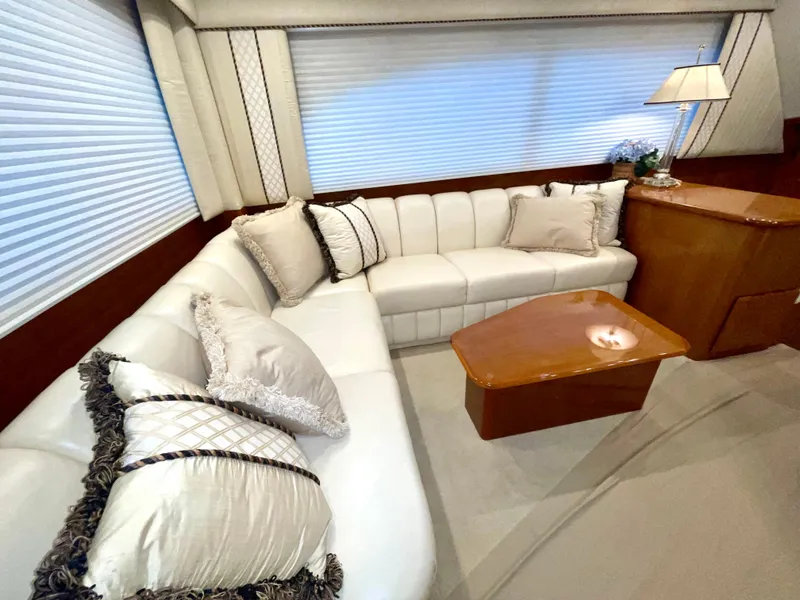 Slide: The Image of Luxurious interior of a 2001 Post 50 Convertible yacht with plush seating and elegant decor. - 10
