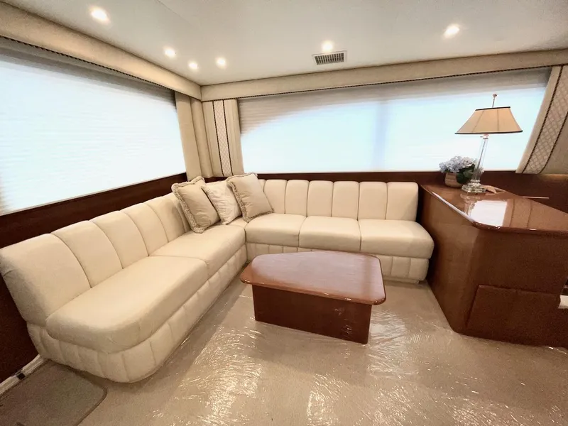 Slide: The Image of Luxurious interior of a 2001 Post 50 Convertible yacht with plush seating and elegant decor. - 11
