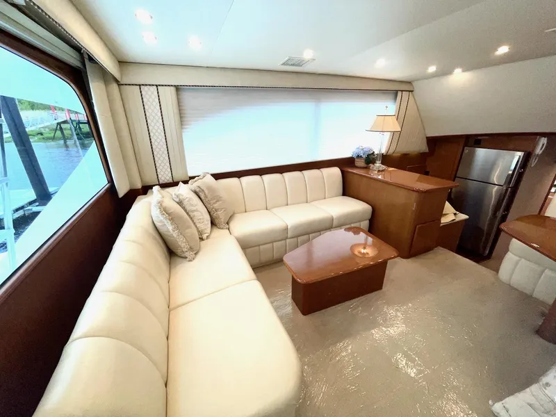 Slide: The Image of Luxurious interior of a 2001 Post 50 Convertible yacht with cream leather seating. - 12