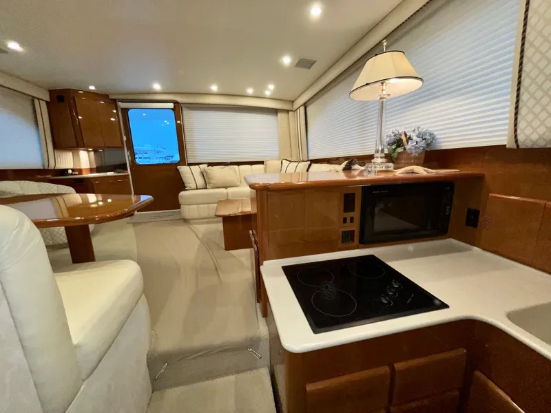 Slide: The Image of Luxurious interior of a 2001 Post 50 Convertible yacht with modern amenities. - 16