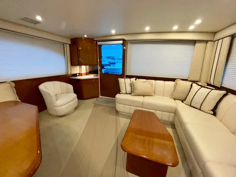 Slide: The Image of Luxurious interior of a 2001 Post 50 Convertible yacht with plush seating and elegant wood finishes. - 2