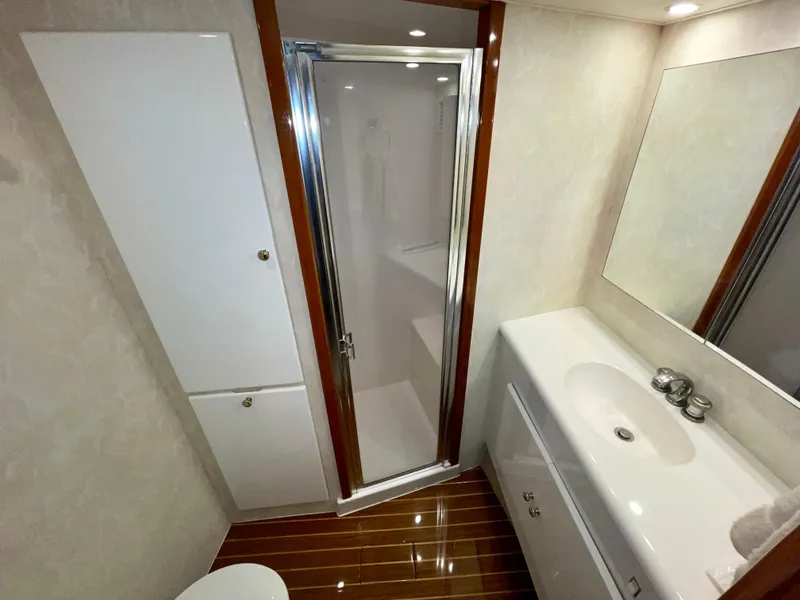 Slide: The Image of Luxurious bathroom in a 2001 Post 50 Convertible yacht with shower and vanity. - 25