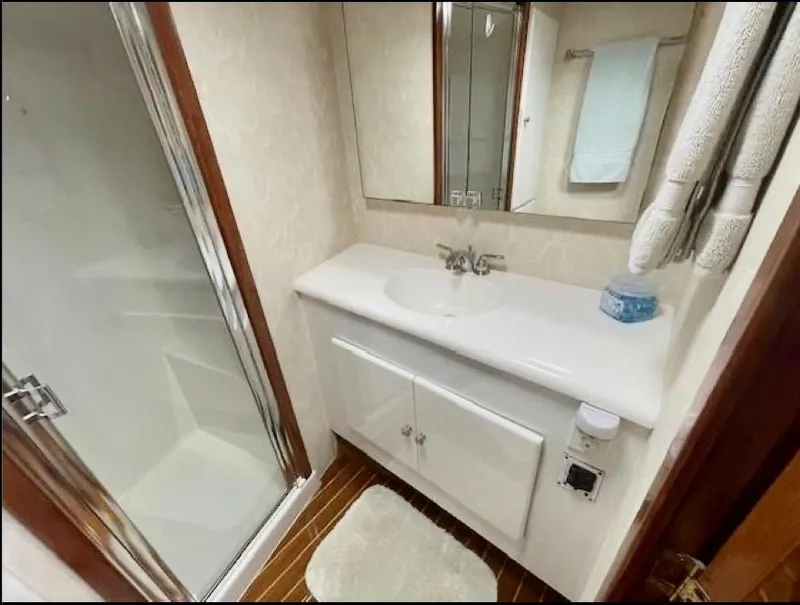 Slide: The Image of Luxurious bathroom in 2001 Post 50 Convertible yacht with shower and vanity. - 27