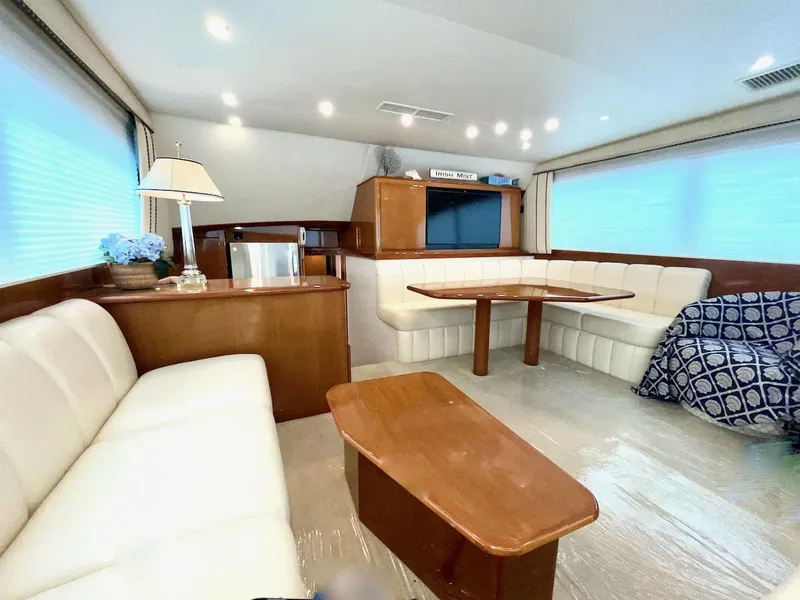 Slide: The Image of Luxurious interior of a 2001 Post 50 Convertible yacht with elegant seating and wooden furnishings. - 3